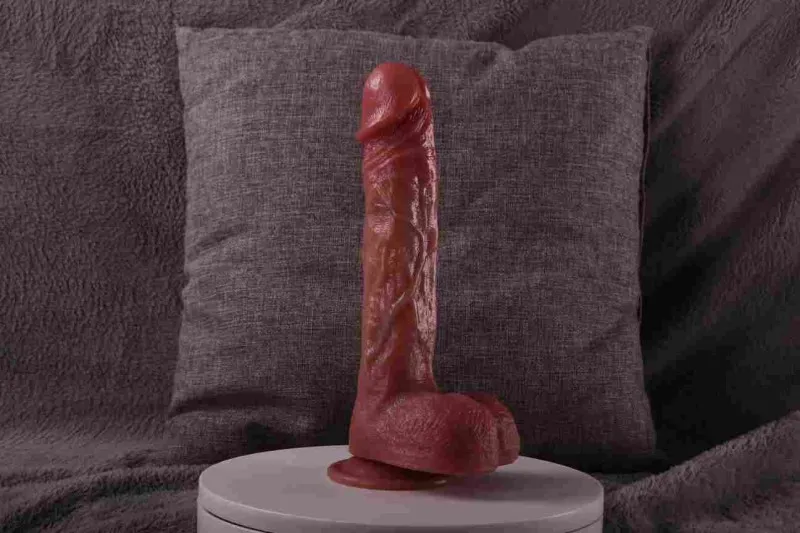 Side view of the KY09 realistic dildo standing on its suction base