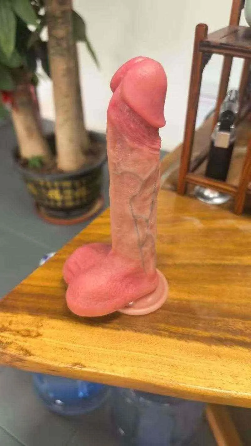 KY10 dildo standing on a wooden table during a real-life photo