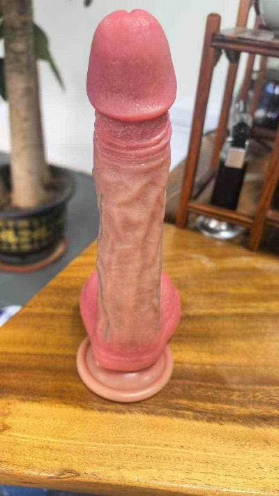 Upright front view of the KY10 remote-control dildo and suction base