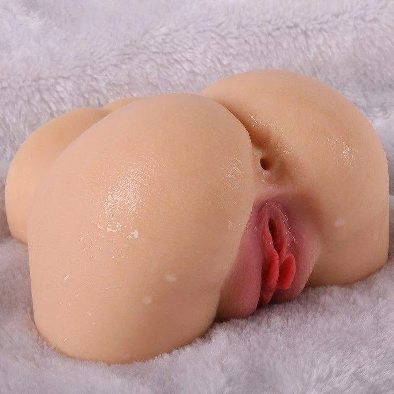 Rear three-quarter view of the KY14 realistic hip masturbator on a soft surface