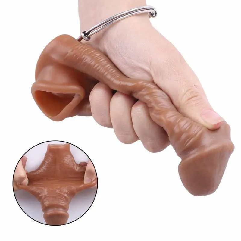 Hand flexing the soft tan KY25 penis sleeve to show how the silicone stretches