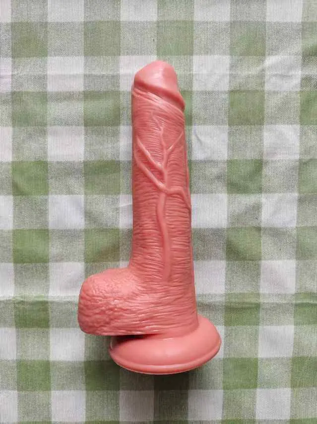 Angled real-life photo of the KY31 silicone suction dildo showing its full 18 cm length