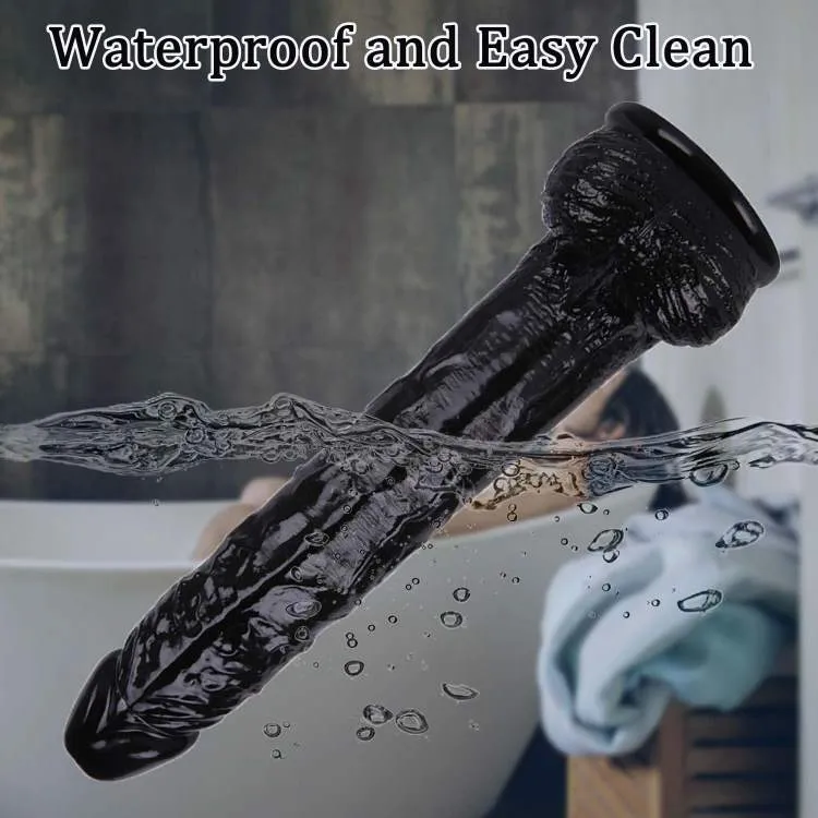 KY32 black silicone dildo underwater to illustrate its waterproof and easy-clean surface